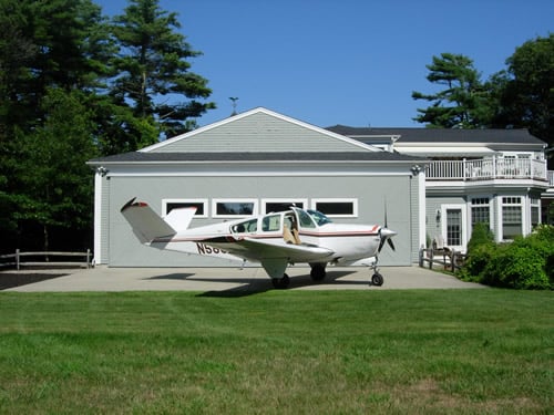 Plane Sitting in Front of Airpark Home