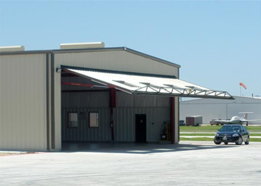 Schweiss hangar door was custom-made for windows to allow natural Lighting