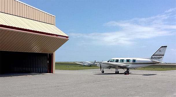 Schweiss bifold door on Nantucket Island Hangar opens up for commuter planes to the mainland