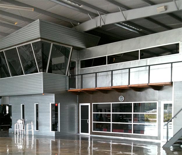 Hangar with 78' x 18' Schweiss Hydraulic Door with large Plexiglas window in Spring, Texas 
