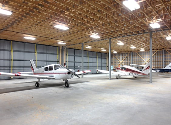Large hangar has two Schweiss doors with patented lift straps