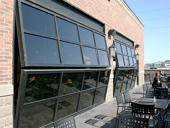 Irish pub connects in and out doors with three 19' by 7' bifold glass doors. The patio adds 70 more seats when weather permits. 