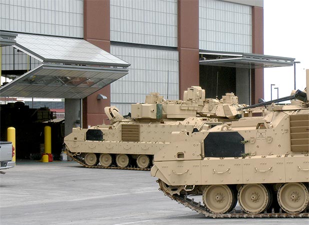 Schweiss bifold doors installed at Fort Carson allow tanks to travel through more than 140 different doors