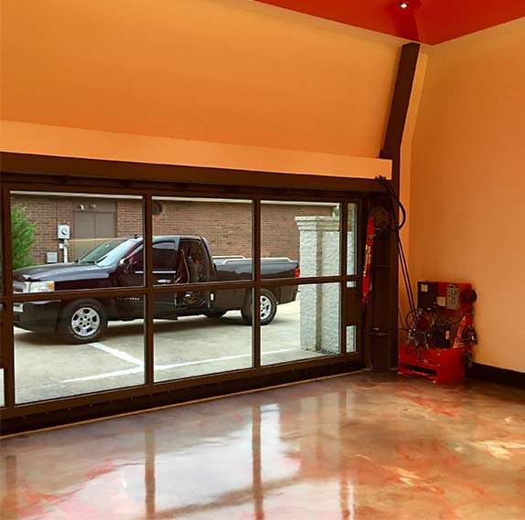 high ceiling in garage gives room for stackable two-car lift
