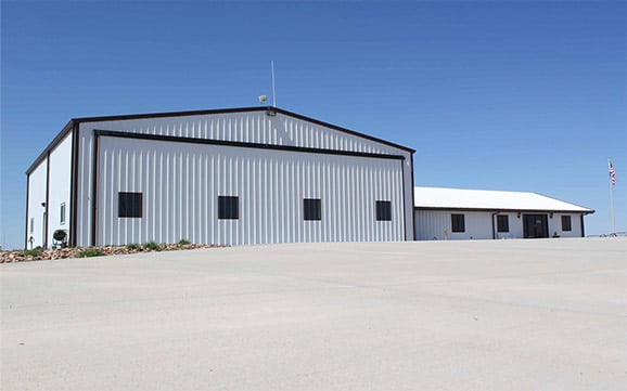 Hydraulic door on shed was planned to storage tall farm equipment and aircraft