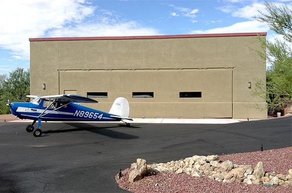 44 x 12 Schweiss hydraulic hangar door gives room to move around Cessna 140 and other vehicles 