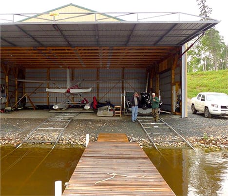 View of boathouse fitted with Schweiss hydraulic door from the front dock landing