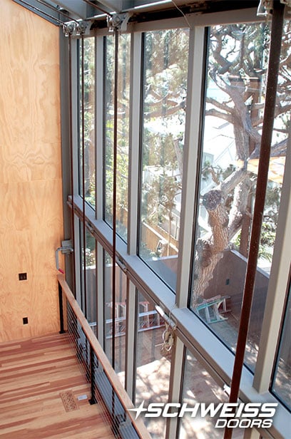 Top-drive bifold designer doors clad in special energy-efficient glass
