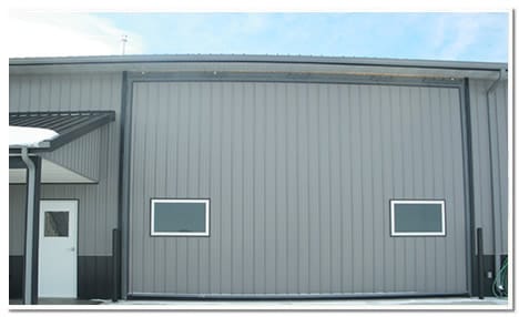 24 by 15 ft hydrualic door is a built for racing dragstrip cars