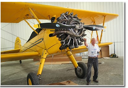 Fuchs stands by the awesome looking engine on his 1942 Stearman PT 13D.