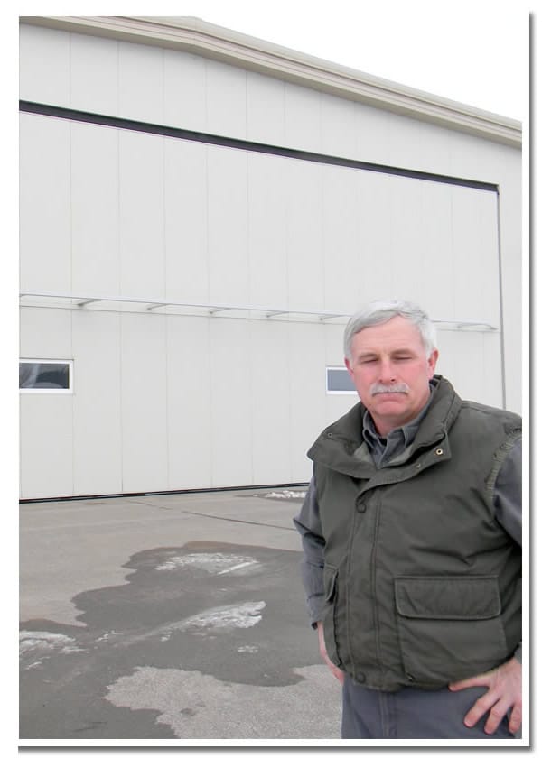 Marty Kiehm in front of hangar and Schweiss Bifold StrapLift Door