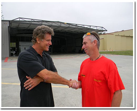 Patrick and Roy the installer of the hangar door shaking hands.