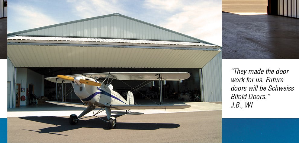 airplane infront of bifold hangar door
