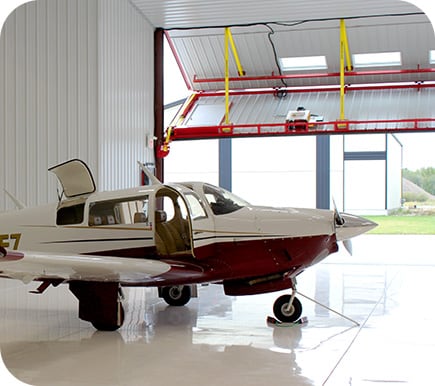 Schweiss Lift Straps on bifold door of plane hangar