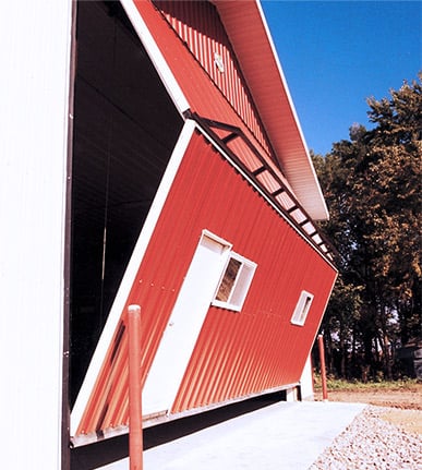 Mandoor on Schweiss Agricultural Doors give easy access through doorframe