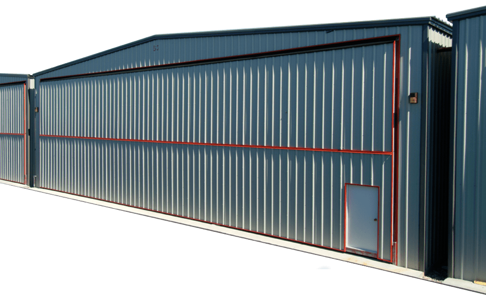 Schweiss Mandoor in doorframe allow bifold door to extend to corners of box hangar