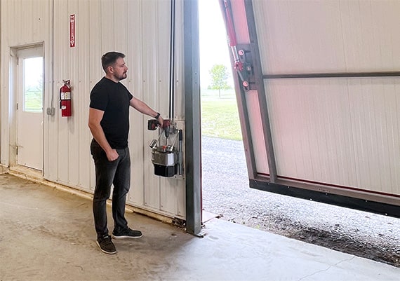 Schweiss Manual Hydraulic Door Being Opened With A Drill