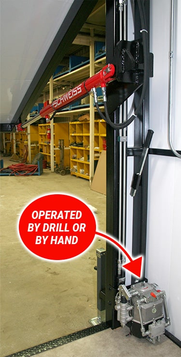 Interior view of the Knights of Columbus food wagon, showing the manual hydraulic pump from Schweiss