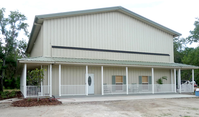 Outside Danville hangar home with custom hydraulic door