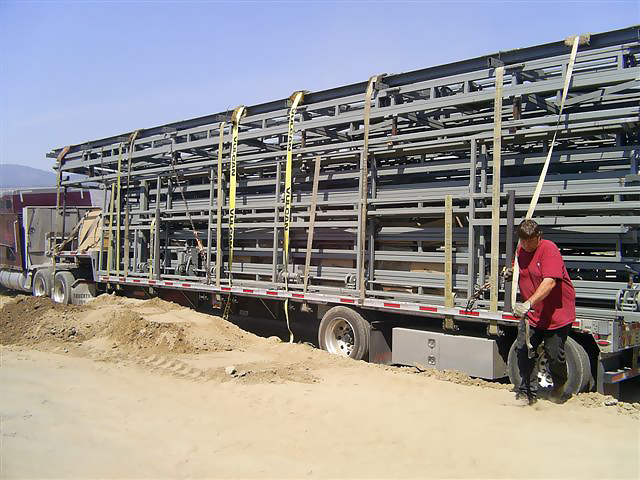 Bifold and hydrualic doors straped down on semi truck