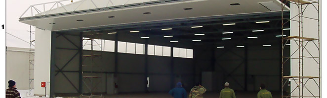 4 Massive Schweiss StrapLift Doors are installed with large external truss in Europe