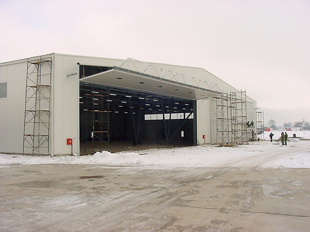 bifold door in full open position on european aircraft hangar