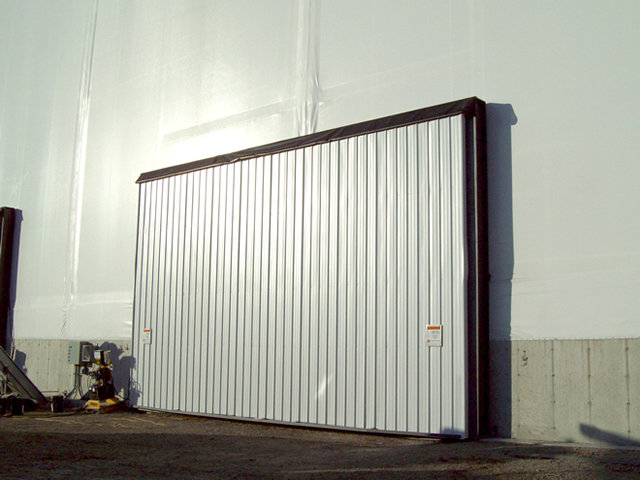 hydraulic door in end wall of fabric building