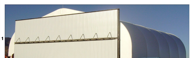 Bifold and Hydraulic doors on hoop buildings with freestanding header
