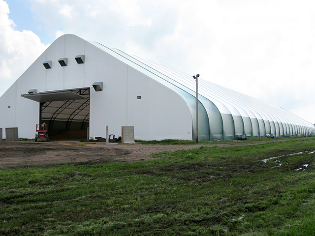 large fabric building with open bifold door