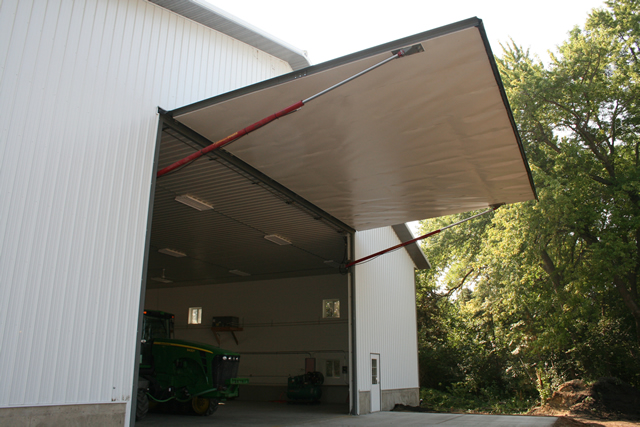 Hydraulic door opens on farm building