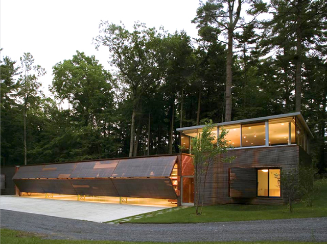 New york lake home with four bifold garage doors