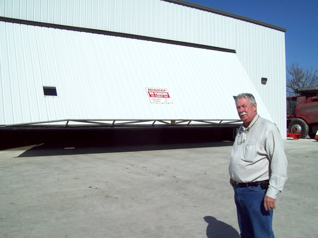 Opening large hydraulic door on machine shop