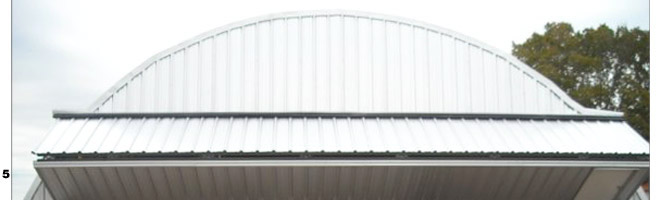 Texas Quonset building adds a StrapLift Bifold Door with Free-standing Header