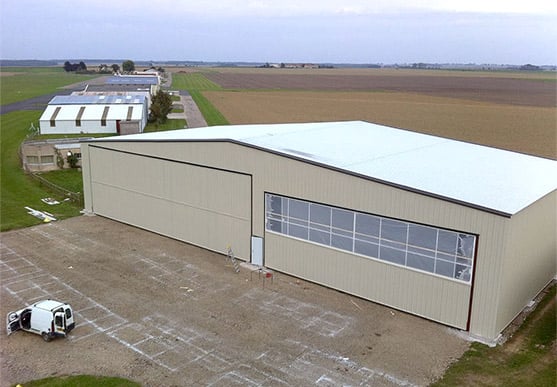 Hangar with Schweiss doors is used as shop for smaller private and corporate planes