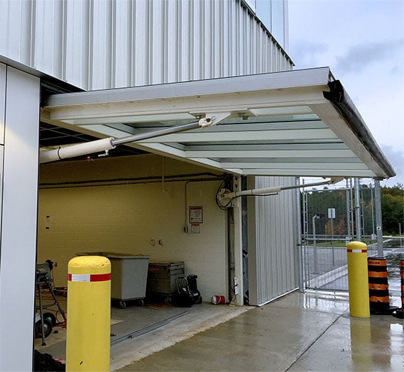 Schweiss hydraulic doors along with 4 bifold doors added during military training base expansion