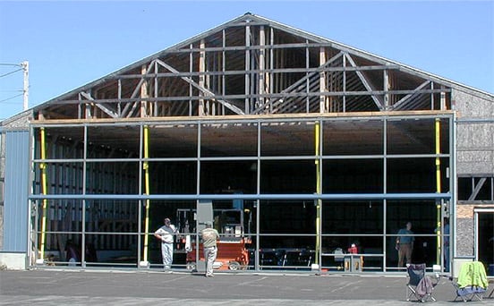 All-steel Schweiss bifold doorframe being installed