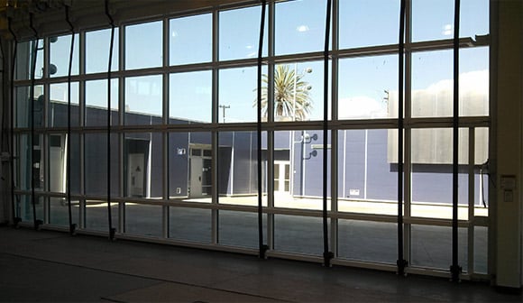 Schweiss Designer door have great view of courtyard and can be opened for easy access to outdoors.