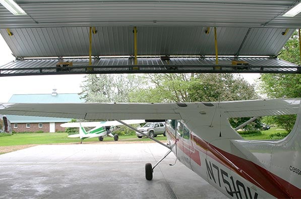 45 foot door on machine shed is lifted by four patented liftstraps.