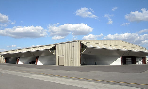 Remote openers and autolatch are equipped on huge hangar's Schweiss bifold doors 