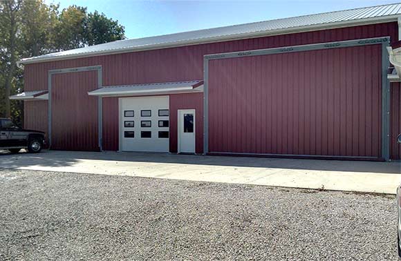 Two Schweiss Hydraulic Doors are at the front of the Iowa Body Shop to save headroom 