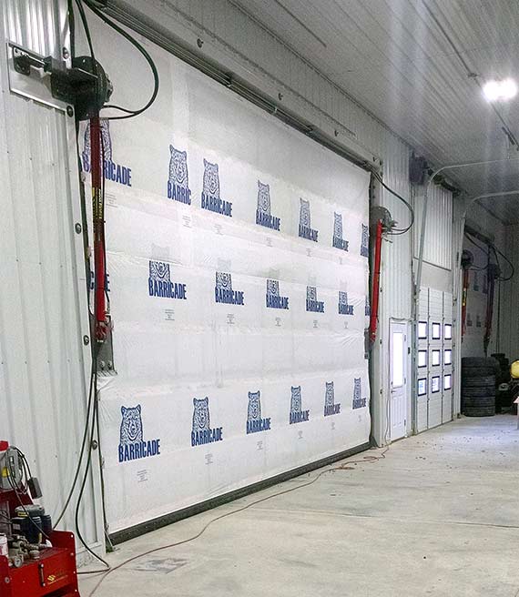 Hydraulic shop doors are a good fit, since he couldn't spare an extra two feet clearance Hydraulic shop doors are a good fit, since he couldn't spare an extra two feet clearance
