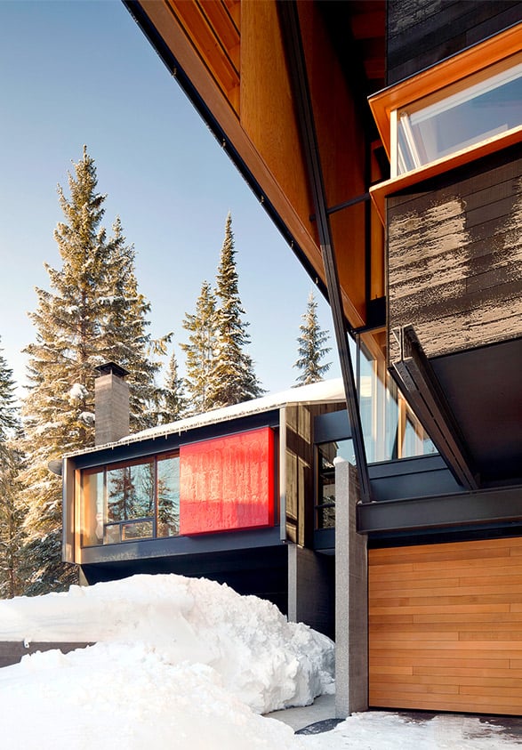 Architectural one-piece garage door at resort has a clean and bright look featuring Red Cedar cladding