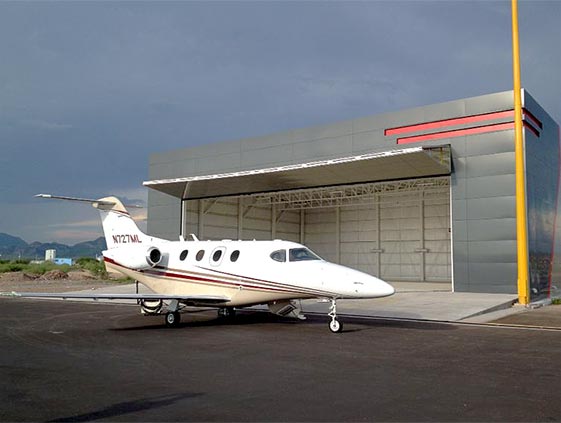 Schweiss Bifold Autolatch/Lifstrap door easily gives access to Hawker Beech Craft Premier A1 