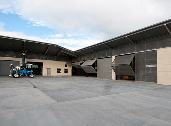 Doors on Workshops and equipment storage buildings in courtyard are all Schweiss Doors