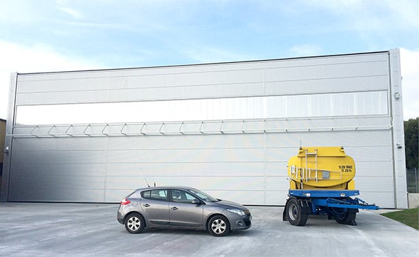 Easy installation of 93 ft by 34 ft Schweiss bifold door on hangar in Poland