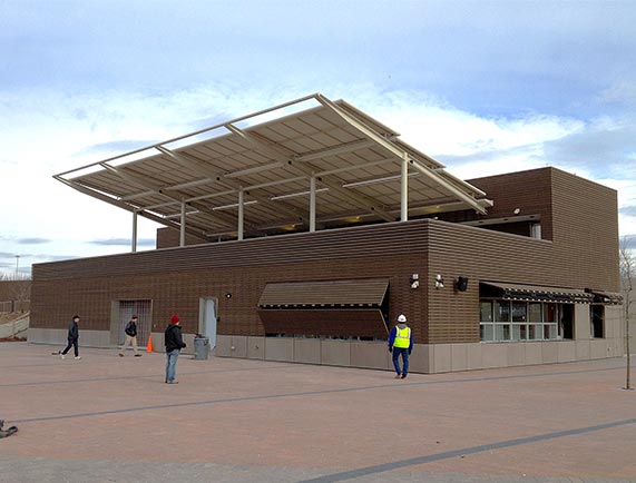 fully opened bifold doors provide shade to the customers buying tickets or food