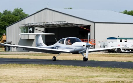 Hangar with 65 foot Schweiss door stores planes and canopy gives skydivers shade during training