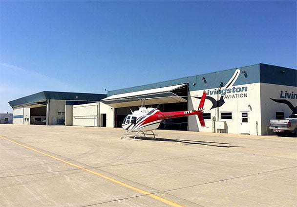 Schweiss bifold door is large enough to store aircraft at airport in Waterloo, IA