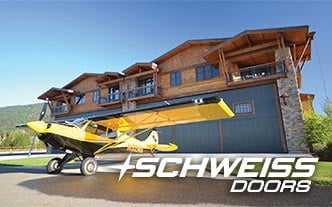 Hangar home liftstrap doors at Airpark Community 