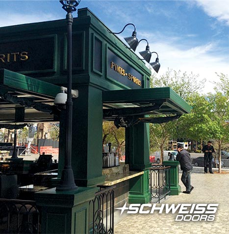 Hydraulic doors used to serve drinks to serve on restaurant patio